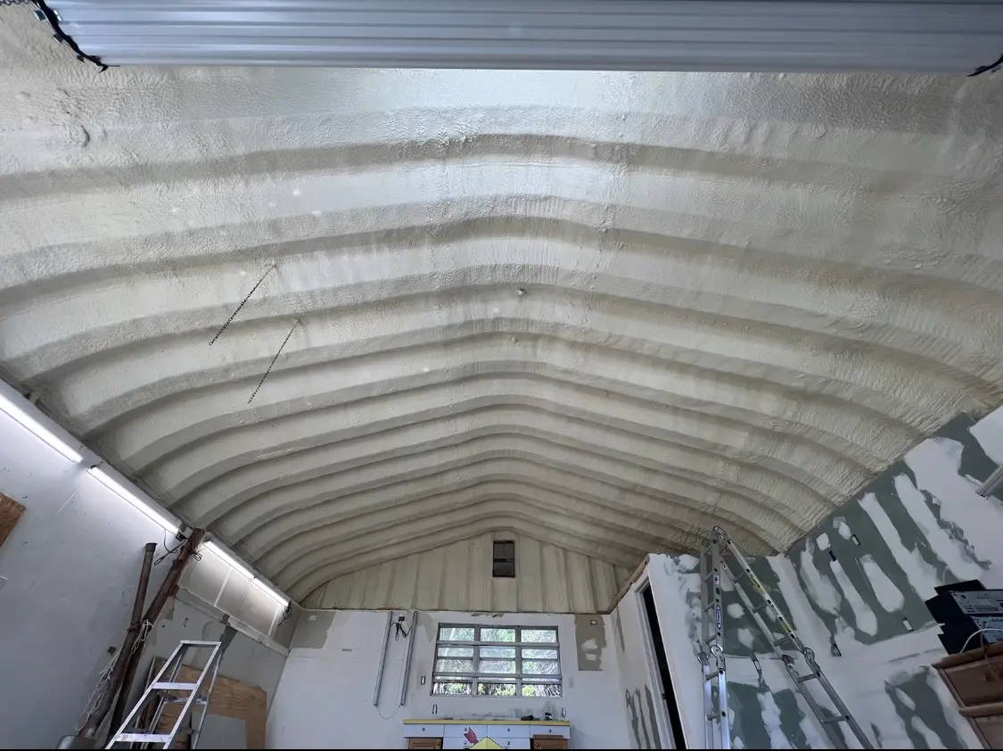 Spray polyurethane foam applied to the underside of a metal roof deck in Tarrytown